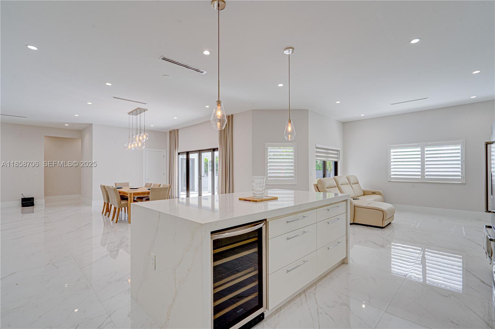 2521 Southwest 105th Avenue Miami, FL 33165 - Photo 5 of 68 a kitchen with a sink and living room view