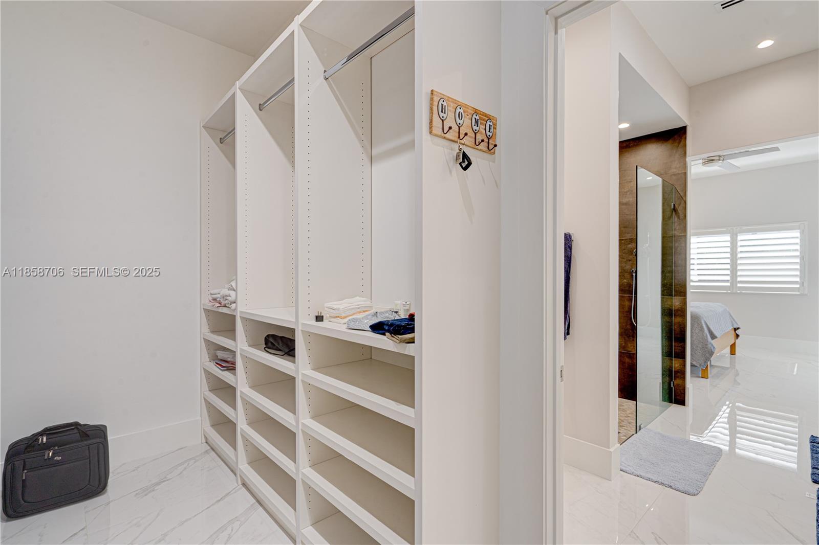 2521 Southwest 105th Avenue Miami, FL 33165 - Photo 51 of 68 a view of walk in closet with empty racks
