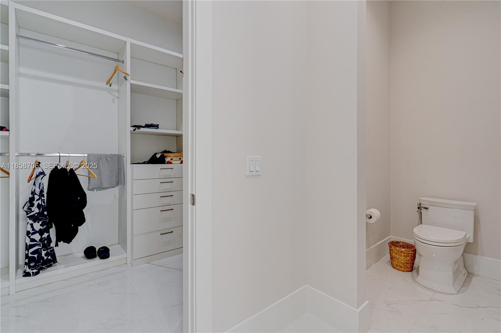 2521 Southwest 105th Avenue Miami, FL 33165 - Photo 56 of 68 a view of walk in closet with clothes and shoes
