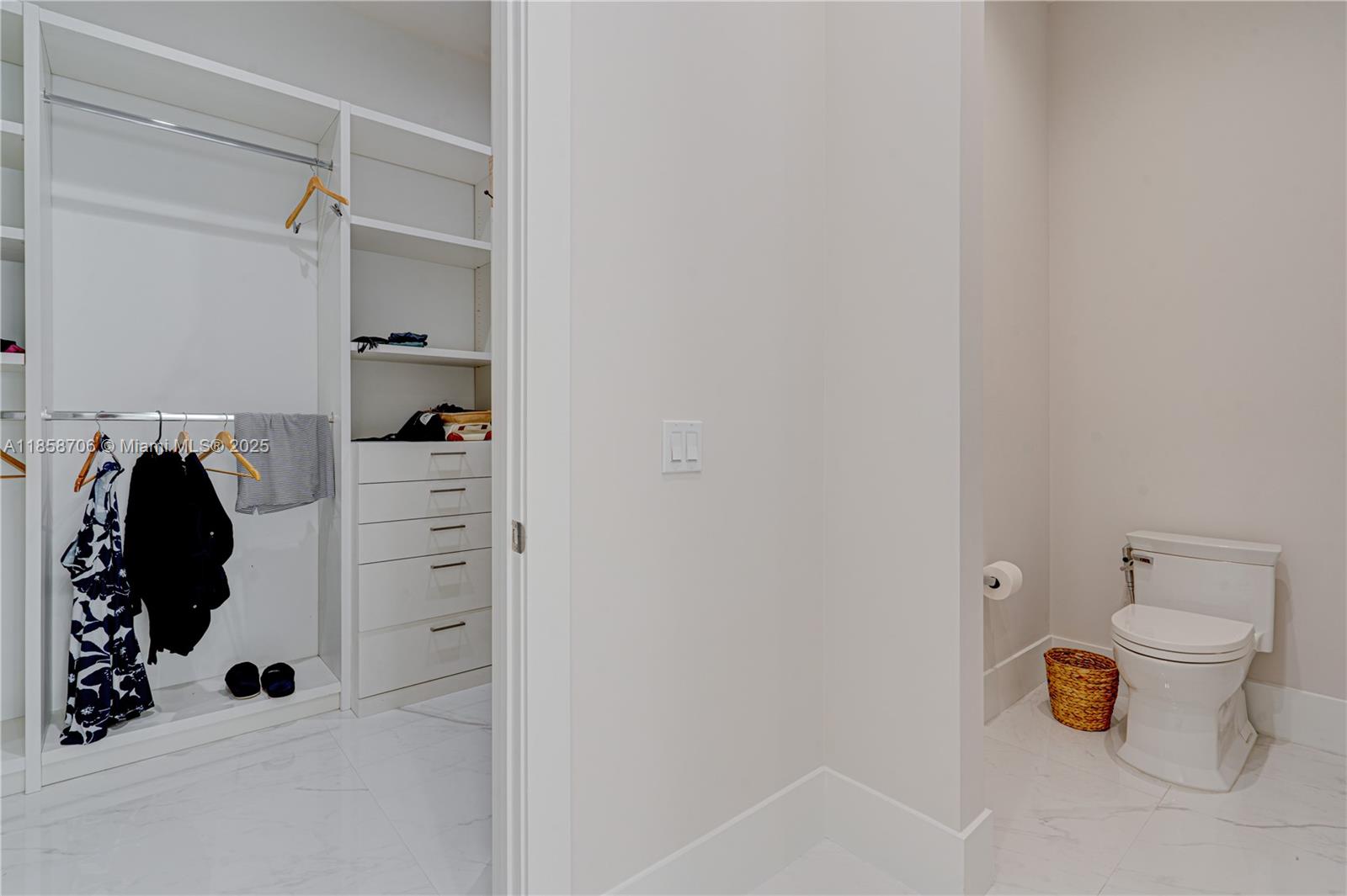 2521 Southwest 105th Avenue Miami, FL 33165 - Photo 56 of 68 a view of walk in closet with clothes and shoes