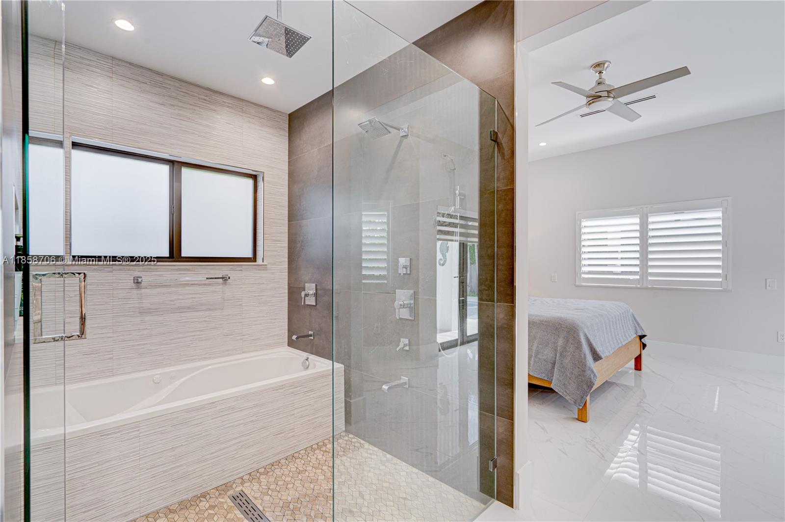 2521 Southwest 105th Avenue Miami, FL 33165 - Photo 58 of 68 a bathroom with a bathtub and a shower