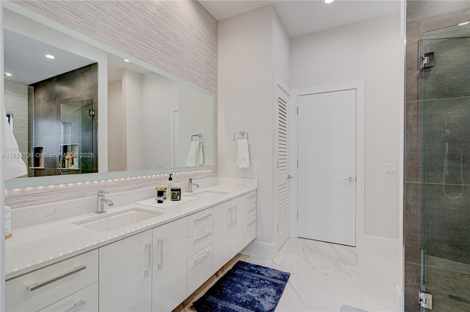 2521 Southwest 105th Avenue Miami, FL 33165 - Photo 59 of 68 a bathroom with double vanity sinks and a mirror