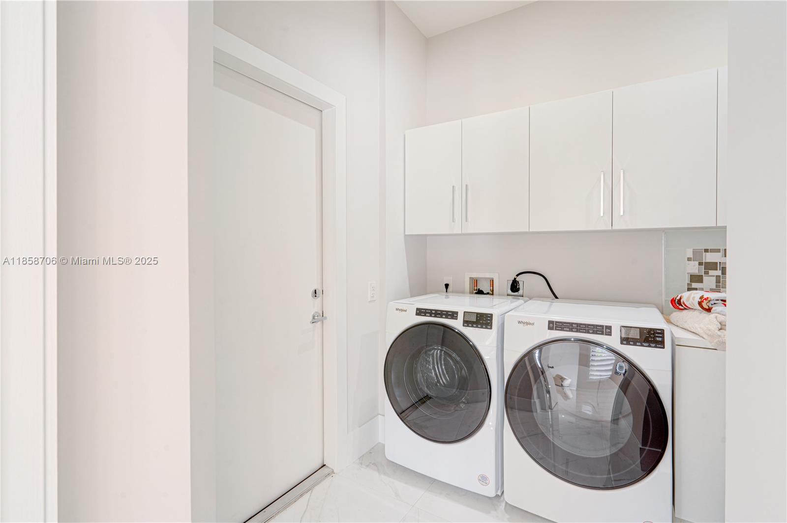 2521 Southwest 105th Avenue Miami, FL 33165 - Photo 65 of 68 a utility room with dryer and washer