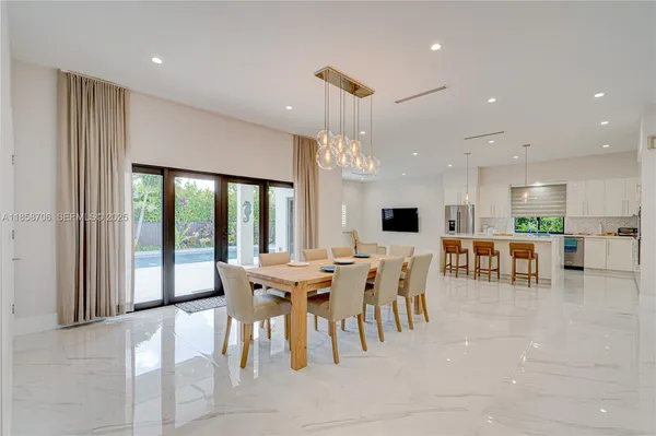 a kitchen with white cabinets and white stainless steel appliances