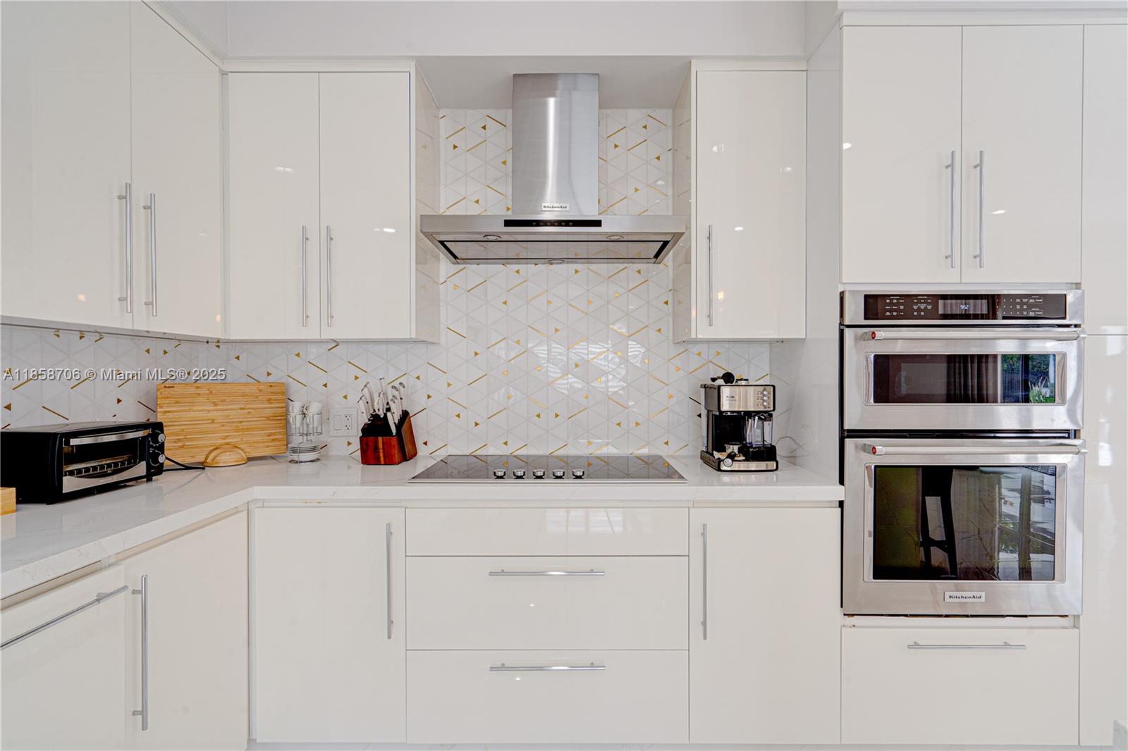 2521 Southwest 105th Avenue Miami, FL 33165 - Photo 9 of 68 a kitchen with granite countertop white cabinets and white appliances
