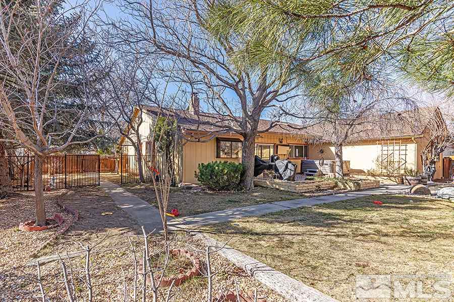 4890 Warren Way Reno, NV 89509 - Photo 17 of 19 a view of a house with a yard covered in snow