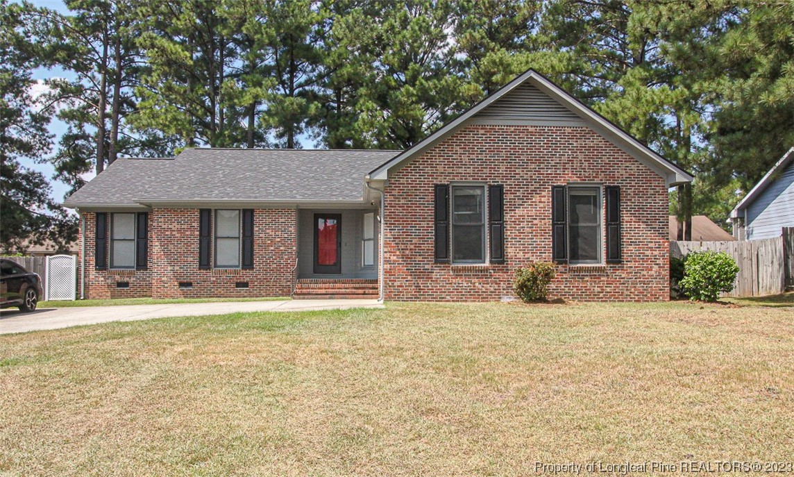 544 Blackbird Road Fayetteville, NC 28314 - Photo 1 of 36 a front view of a house with a yard and garage