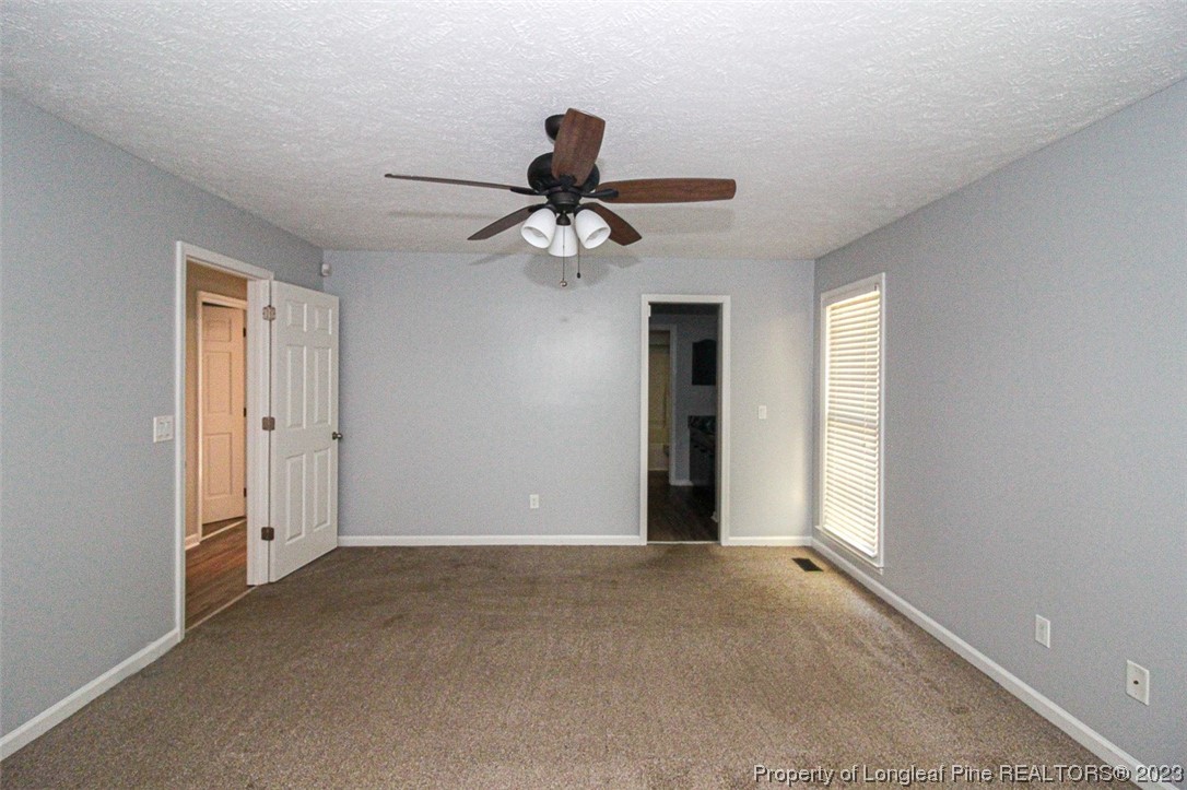 544 Blackbird Road Fayetteville, NC 28314 - Photo 21 of 36 a view of a livingroom with a ceiling fan