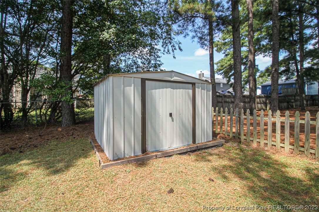 544 Blackbird Road Fayetteville, NC 28314 - Photo 27 of 36 a backyard of a house with a tree