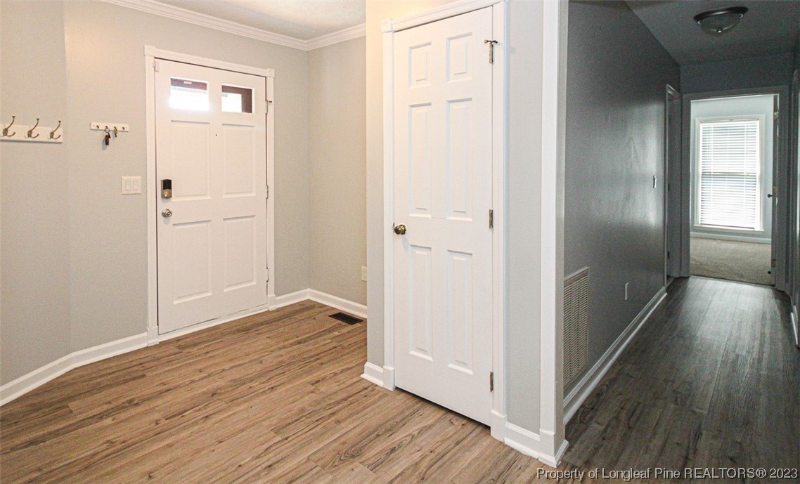 544 Blackbird Road Fayetteville, NC 28314 - Photo 5 of 36 a view of a hallway with wooden floor