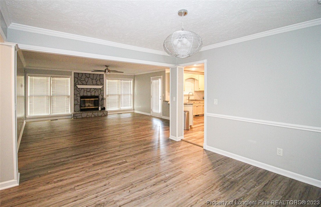 544 Blackbird Road Fayetteville, NC 28314 - Photo 6 of 36 a view of an empty room with wooden floor and a window