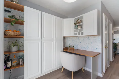 a kitchen with a table and chairs