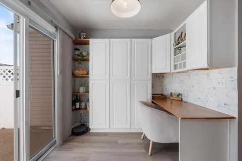 a kitchen with a refrigerator and cabinets