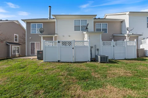 a view of a white building with many windows