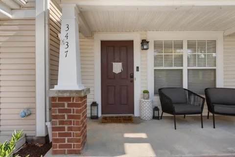 a couple of chairs in front of door