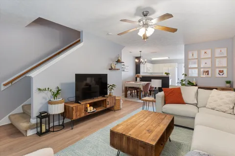 a living room with furniture and a flat screen tv