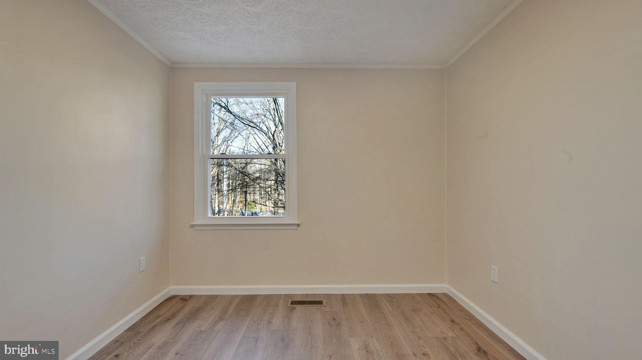 10965 La Plata Road La Plata, MD 20646 - Photo 11 of 24 wooden floor in an empty room with a window