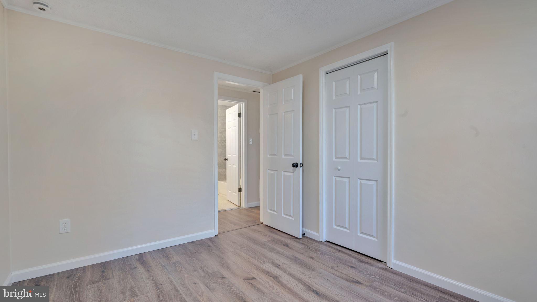 10965 La Plata Road La Plata, MD 20646 - Photo 12 of 24 a view of an empty room and wooden floor