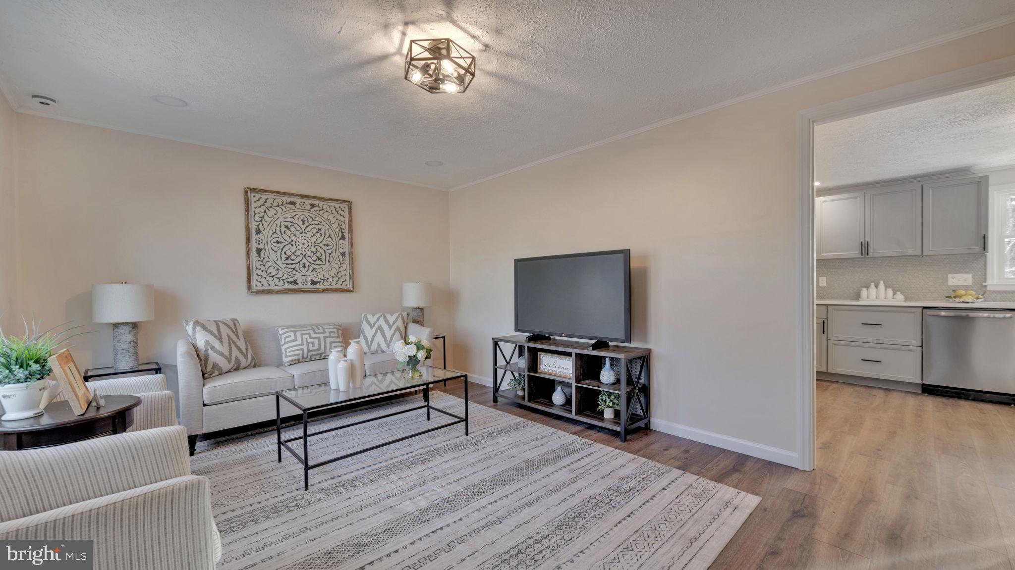10965 La Plata Road La Plata, MD 20646 - Photo 3 of 24 a living room with furniture and a flat screen tv