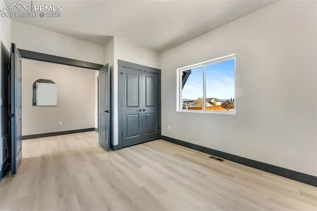 a view of an empty room and window