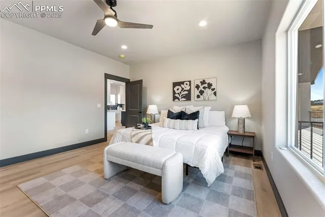 a bed room with a bed and a lamp