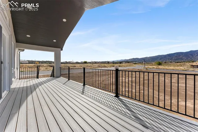 a view of balcony with wooden floor