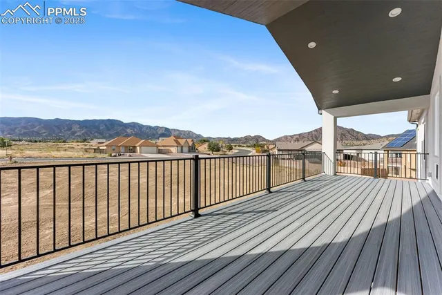 a view of wooden balcony with city view
