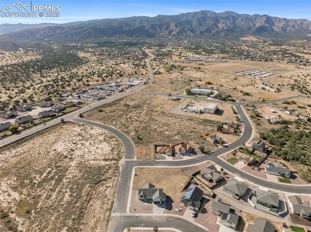 a view of a house with wooden roof and fence