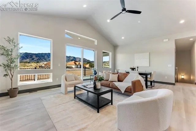 a living room with fireplace furniture and a window