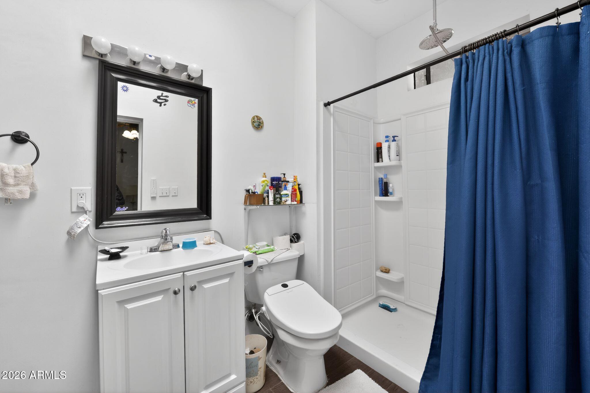 277 Círculo Silva Rio Rico, AZ 85648 - Photo 21 of 34 a bathroom with a sink toilet and shower