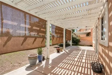 a view of a porch with wooden floor
