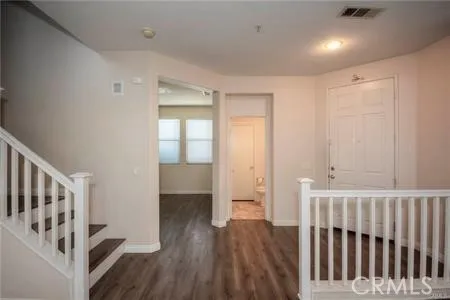a view of entryway with wooden floor
