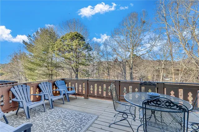 a view of a chairs and table in patio