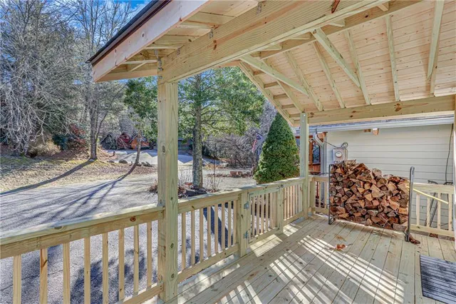 a view of a house with a chairs and deck