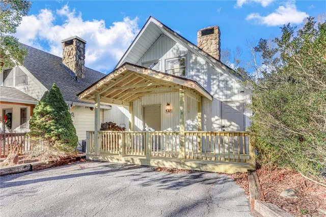 an aerial view of a house with a swimming pool yard and outdoor seating