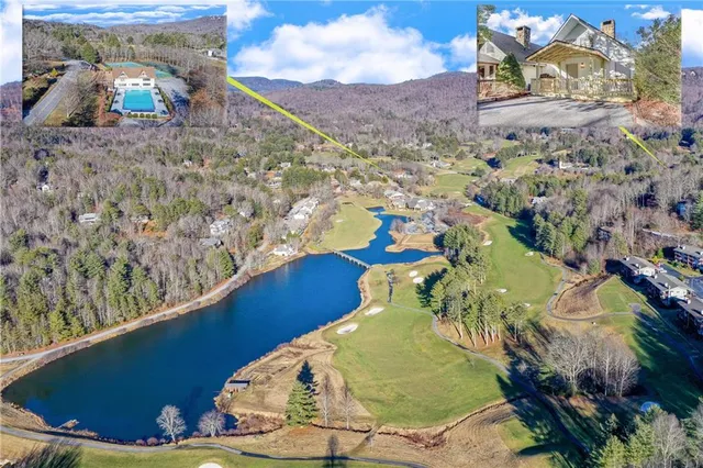 a view of a swimming pool with a yard
