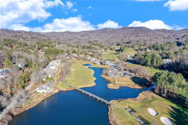 a view of a swimming pool with a yard