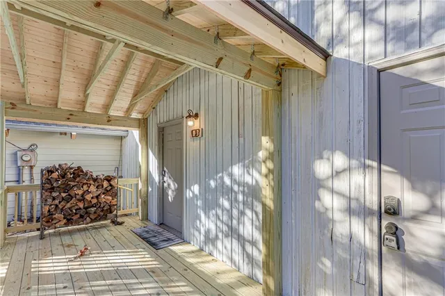 a view of a entryway door of the room