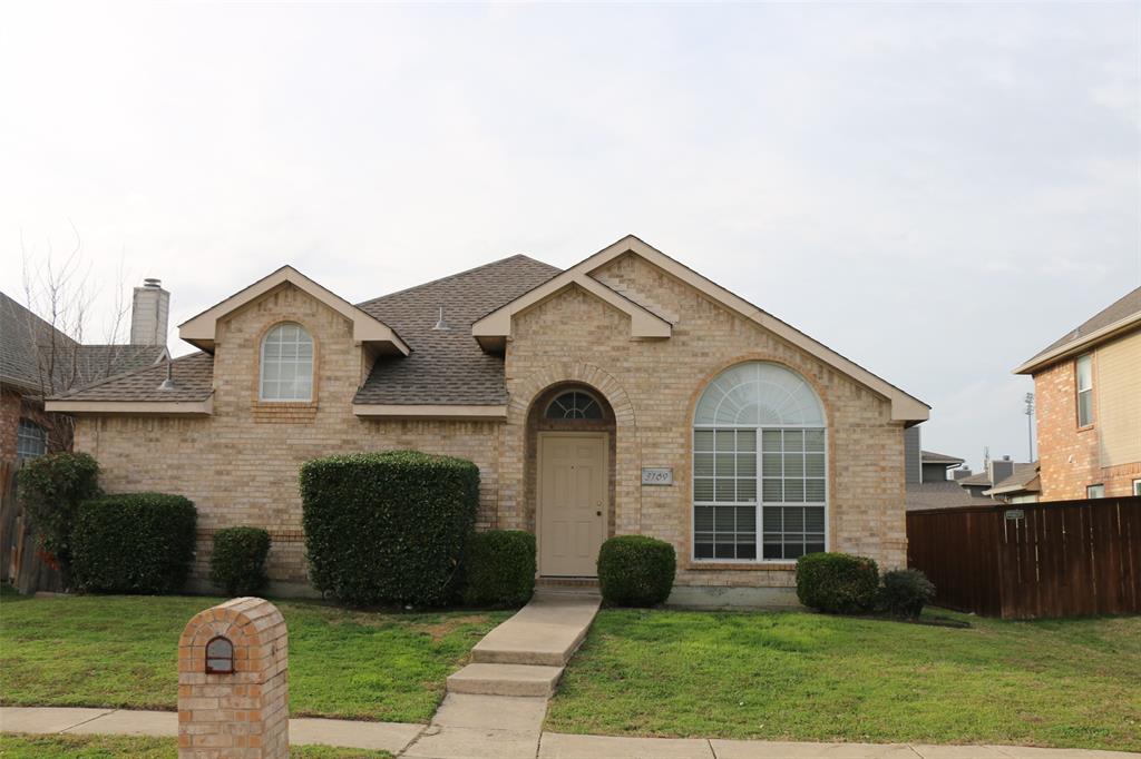 3169 Riverside Drive Carrollton, TX 75007 - Photo 1 of 16 a front view of a house with a yard