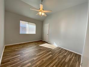 3169 Riverside Drive Carrollton, TX 75007 - Photo 12 of 16 a view of an empty room with wooden floor and a window