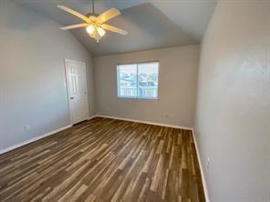 3169 Riverside Drive Carrollton, TX 75007 - Photo 13 of 16 wooden floor in an empty room with a window
