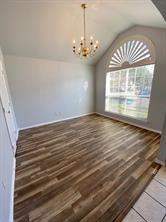 3169 Riverside Drive Carrollton, TX 75007 - Photo 7 of 16 a view of empty room with wooden floor and fan