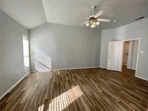 3169 Riverside Drive Carrollton, TX 75007 - Photo 8 of 16 wooden floor in an empty room with a window