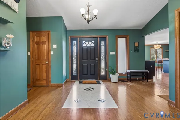a kitchen with granite countertop a refrigerator and a sink