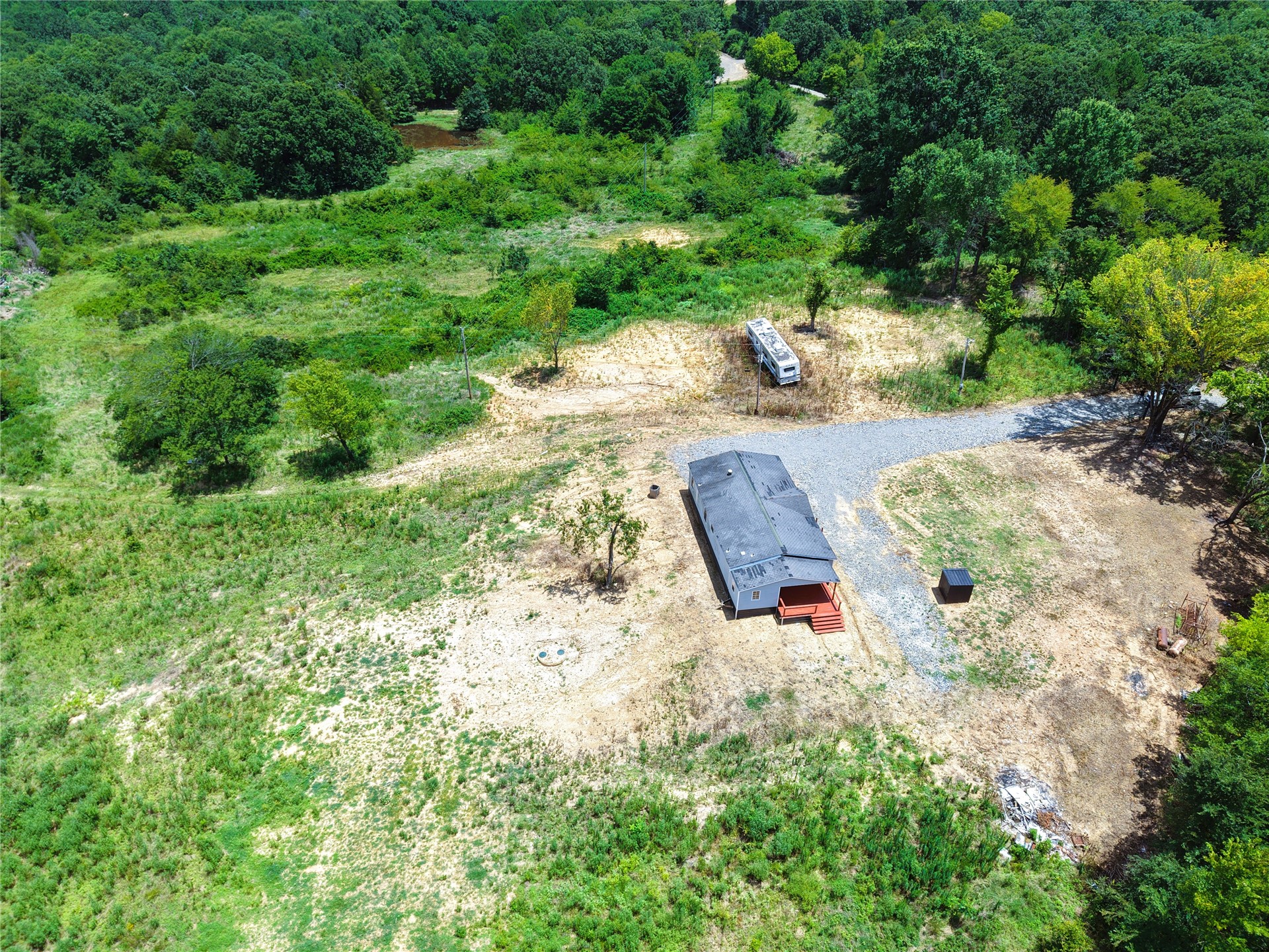 33594 Johnson Shady Point Shady Point, OK 74956 - Photo 2 of 18 Extensive acreage with dense surrounding tree canopy