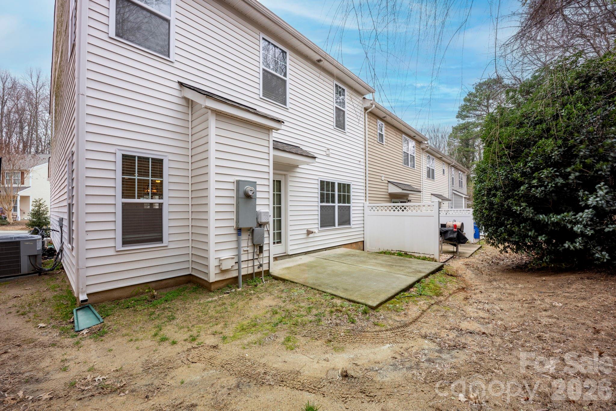 179 Limerick Road, Unit D Mooresville, NC 28115 - Photo 20 of 21 a view of a house with a yard