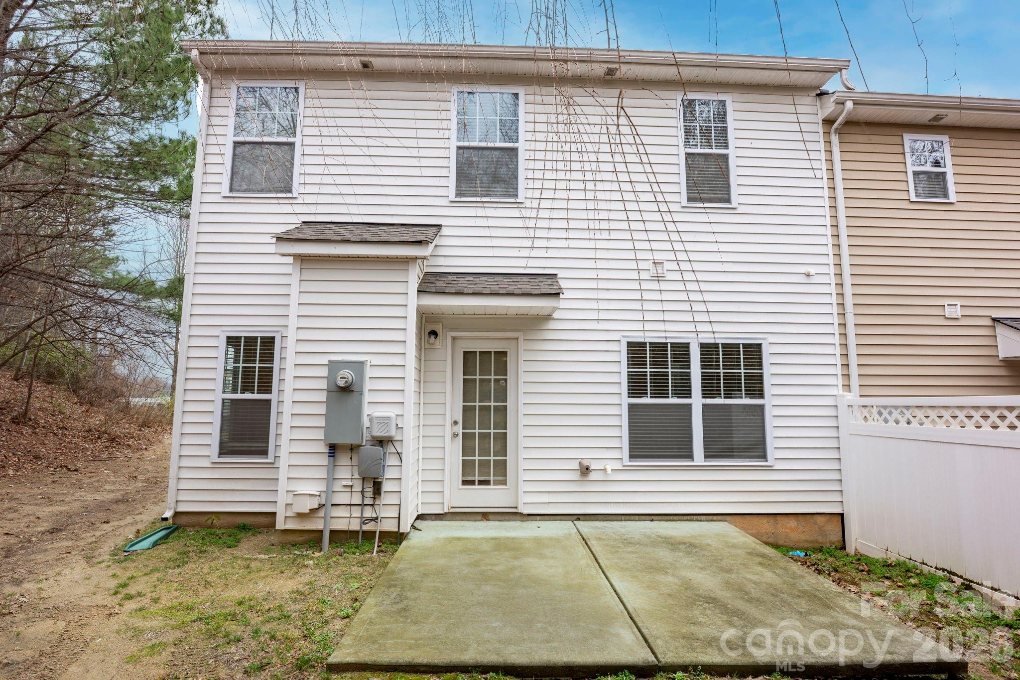 179 Limerick Road, Unit D Mooresville, NC 28115 - Photo 21 of 21 a view of a house with a yard and wooden fence