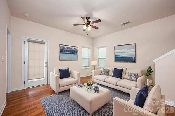 a living room with furniture and a rug