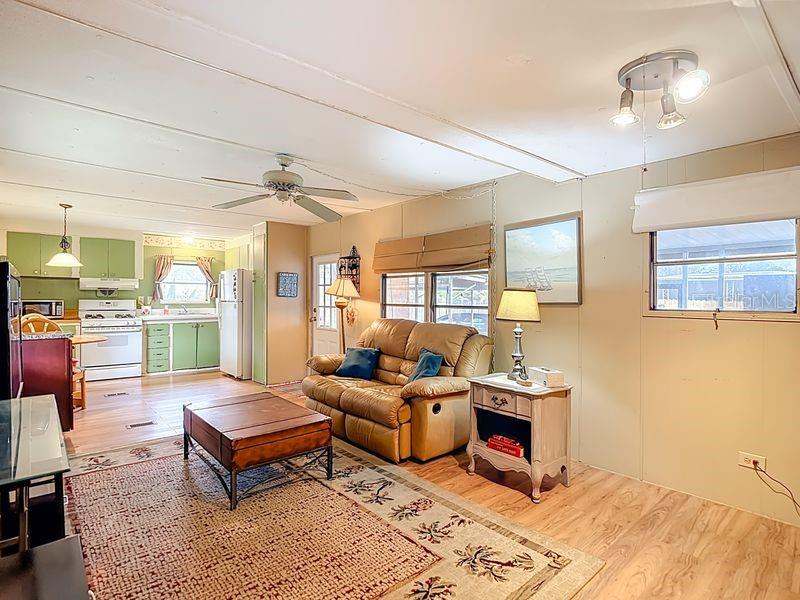 8145 Campbell Court New Port Richey, FL 34653 - Photo 11 of 34 a living room with furniture and wooden floor