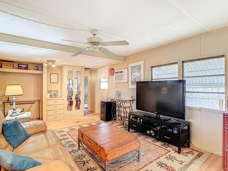 8145 Campbell Court New Port Richey, FL 34653 - Photo 13 of 34 a living room with furniture and a flat screen tv
